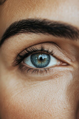 A middle-aged Brazilian woman eye with a pencil-groomed eyebrow, elegantly shaped with clean, defined strokes. The arch enhances her modern and stylish appearance.