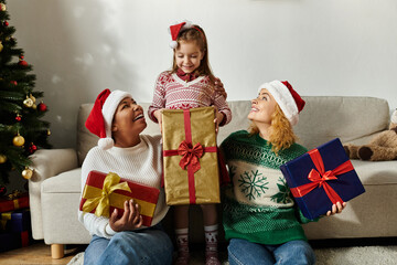 A loving couple enjoys their time with their daughter during the festive holiday season at home.