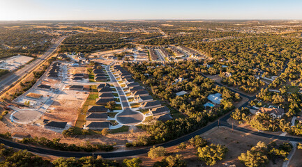 Aerial drone view of new homes occupied and under construction in Sun City near Georgetown, Texas...