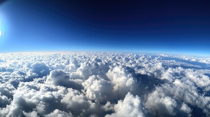 A panoramic view of fluffy fair-weather clouds scattered across a bright blue sky, creating a serene and open atmosphere on a clear day. --chaos