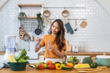 Portrait asian beauty body slim woman drinking water from a bottle while relax and feeling fresh, refresh drink, wellness, diet, healthcare, mineral at home.Healthy liquid lifestyle concept