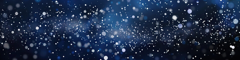 Obraz premium A deep navy blue background with scattered silver glitter, giving it a sophisticated and mystical feel.