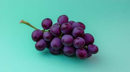 A vibrant purple grape bunch on a light green background