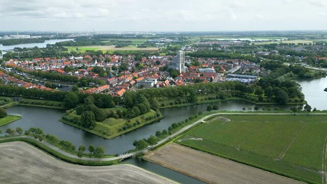 beautiful fortified town brielle netherlands 17th century church fortifications river flows through historic aerial panning shot view historical architecture townscape dutch history 