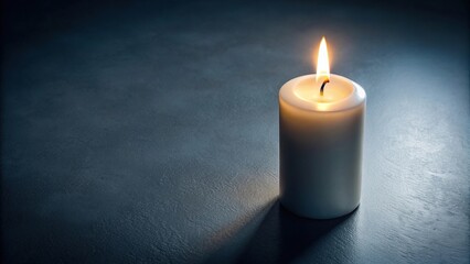 Aerial view of white candle burning at night with focus on single candle in foreground