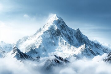 Obraz premium Majestic snow-capped mountain towering over the clouds in a clear, serene blue sky