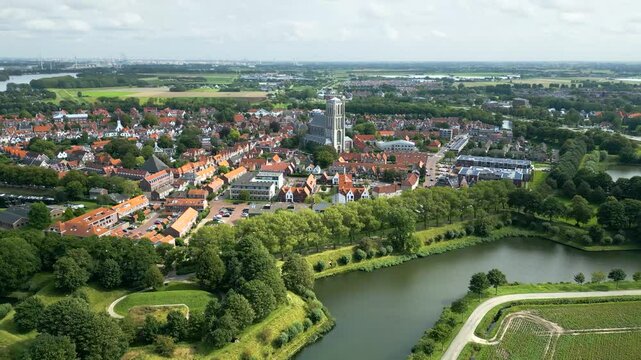 moving 17th century church brielle revealing well preserved fortifications historic dutch town backward aerial shot netherlands fortified view motion historical architecture 