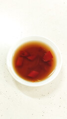 spicy hot chilli sauce in white plastic container