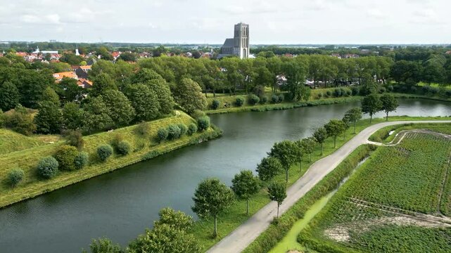 revealing brielle&rsquo;s 17th century church fortifications lush green parks surrounding fortified town upward aerial netherlands motion view landscape dutch history 