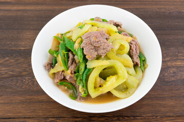 A dish of home-cooked green tomato beef