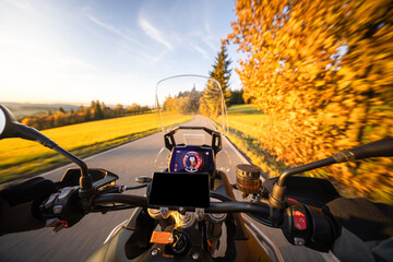 Travel motorcycle ride on an asphalt road.