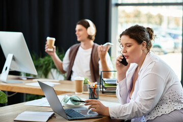 A young plus size woman talks on the phone, while her friend relaxes with coffee in a bright space.