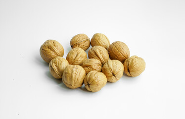 Ripe dry split walnut. Walnuts Isolated on White Background. closeup of shelled organic walnut halves. walnut, nut, full depth of field