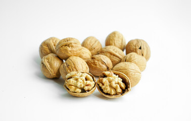 Ripe dry split walnut. Walnuts Isolated on White Background. closeup of shelled organic walnut halves. walnut, nut, full depth of field