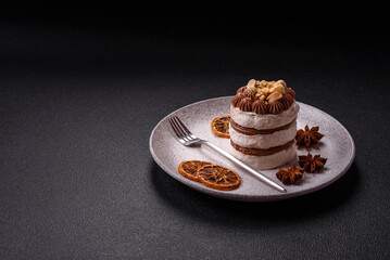 Sweet puff tart with meringue, cream and nuts