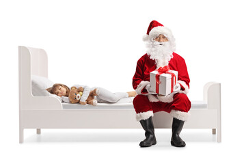 Santa claus delivering a christmas present to a sleeping girl