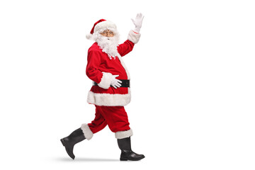Santa Claus walking and waving at camera