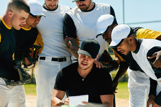 Men, coach and baseball with team for game plan, strategy or meeting in match, tournament or competition. Young, group or players with trainer or referee for instructions, rules or formation on pitch - Powered by Adobe