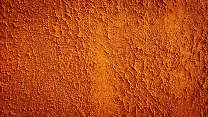 Texture of macro burnt orange and peach plastered wall
