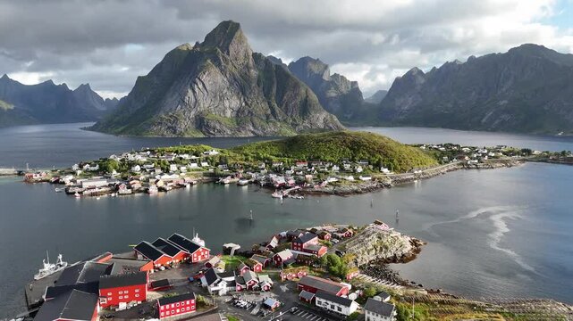 Establishing Aerial View Above Traditional Rorbuer Fishing Cabins. Reine Lofoten, Norway in 4K.