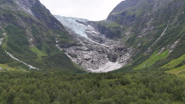 Aerial Briksdalsbreen Glacier in Norway, Briksdal, Scandinavia with thick ice. Epic mountain nature.