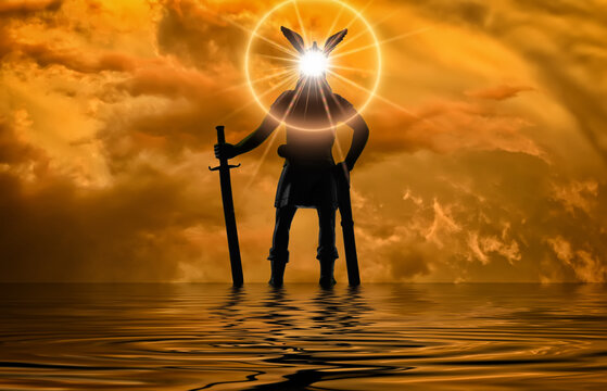 Black silhouette of Old Norse god Odin with bright star shining in his head and sword in his hand, standing in the water against dramatic sky, Valhalla, Asgard, Viking mythology