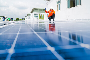 engineer man inspects construction of solar cell panel or photovoltaic cell by electronic device....