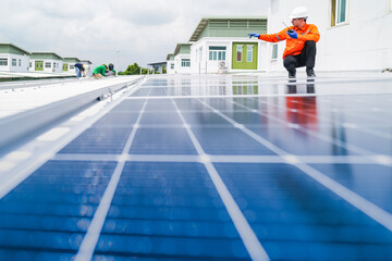 engineer man inspects construction of solar cell panel or photovoltaic cell by electronic device....