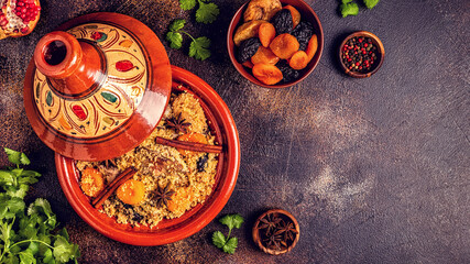 Traditional moroccan tajine of chicken with dried fruits and spices.