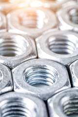 Close-up steel nuts background.Industrial background.bolts and nuts.Close-up of various screws. Use for background, top view.