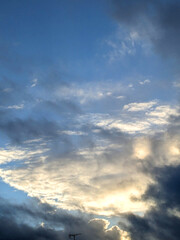 Fluffy White Clouds in a Blue Sky as A Skyscape Background