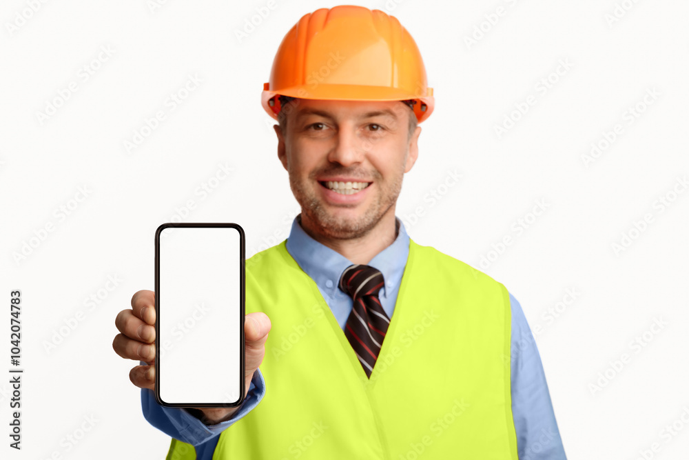 Poster Building Services. Construction Worker Showing Cellphone Empty Screen Smiling To Camera Standing On White Studio Background. Selective Focus, Mockup