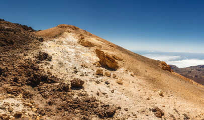 Teide Volcano towers above the unique rocky terrain of Tenerife, part of the Canary Islands, illustrating the dramatic geological features created by ancient volcanic activity.