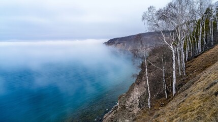 Crystal-clear waters of Lake Baikal surrounded by fog