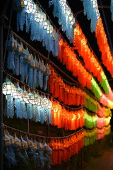 Row of hanging lanterns at night