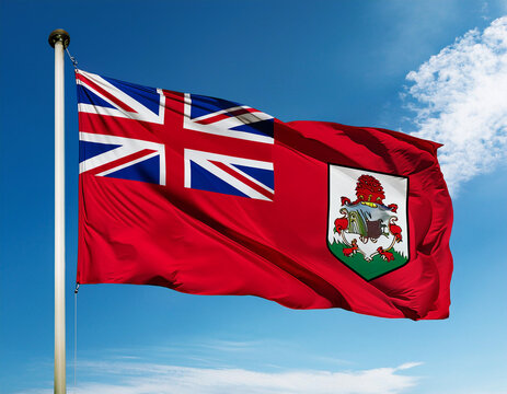 Bermuda flag waving in the wind against a blue sky background