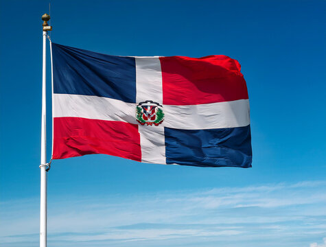 Dominican flag waving in the wind against a blue sky background