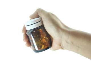 Female hand holding brown antibiotic bottle isolated on transparent background.