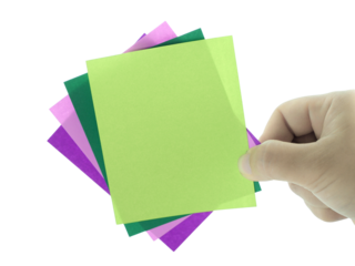 Female hand holding blank note paper isolated on transparent background.