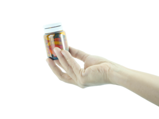 Female hand holding brown antibiotic bottle isolated on transparent background.