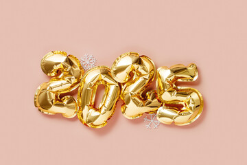 Golden foil balloons forming number 2025  with white snowflakes on pink background, Happy New Year Eve celebration, top view layout. Festive Christmas minimal photo for winter holidays, copyspace