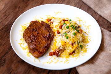 Authentic Brazilian food, grilled picanha steak with birobiro rice