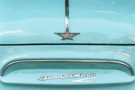 Shiny body parts of a Soviet retro car. Saint Petersburg, Russia - 15 Aug 2024