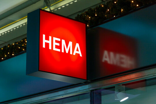 Hema logo above the shop entrance, a discount retail chain store at Schiphol Airport Amsterdam. Amsterdam, the Netherlands. 6 December 2023. 