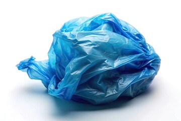 Crumpled blue plastic bag on white background emphasizing waste reduction