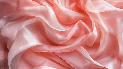 Obraz premium Soft, flowing pink fabric drapes elegantly on a surface, creating delicate textures and patterns