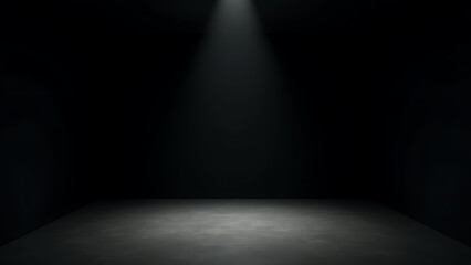 A contemporary black box stage with plain black walls, minimalist design, and bright overhead lighting illuminating the space.
