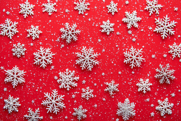 backdrop featuring white snowflakes scattered over a vibrant red background, perfect for holiday-themed designs and decorations.