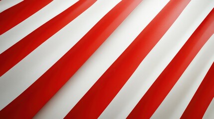 Fototapeta premium Bold red and white diagonal stripes, forming a striking pattern on a smooth white background.