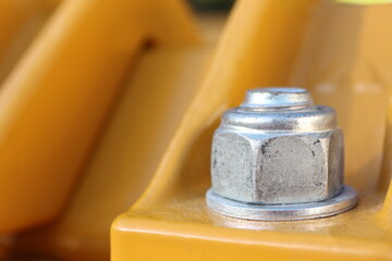 A Highly Detailed CloseUp View of a Metal Industrial Nut Lovingly Secured on a Piece of Machinery